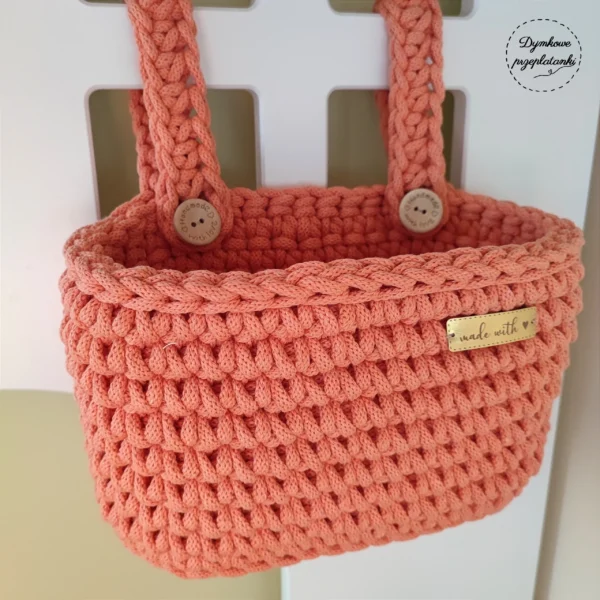 pomarańczowy organizer na łóżeczko dziecięce handmade na szydełku